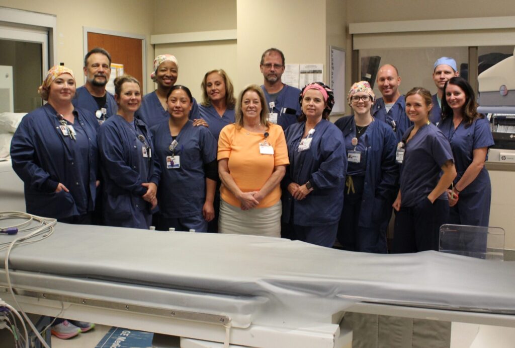 Heart team members lined up for photo in Cath Lab.