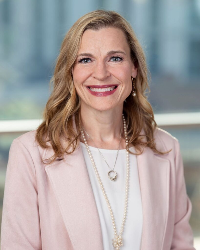 Head shot of Dr. Pesut in pink suit.