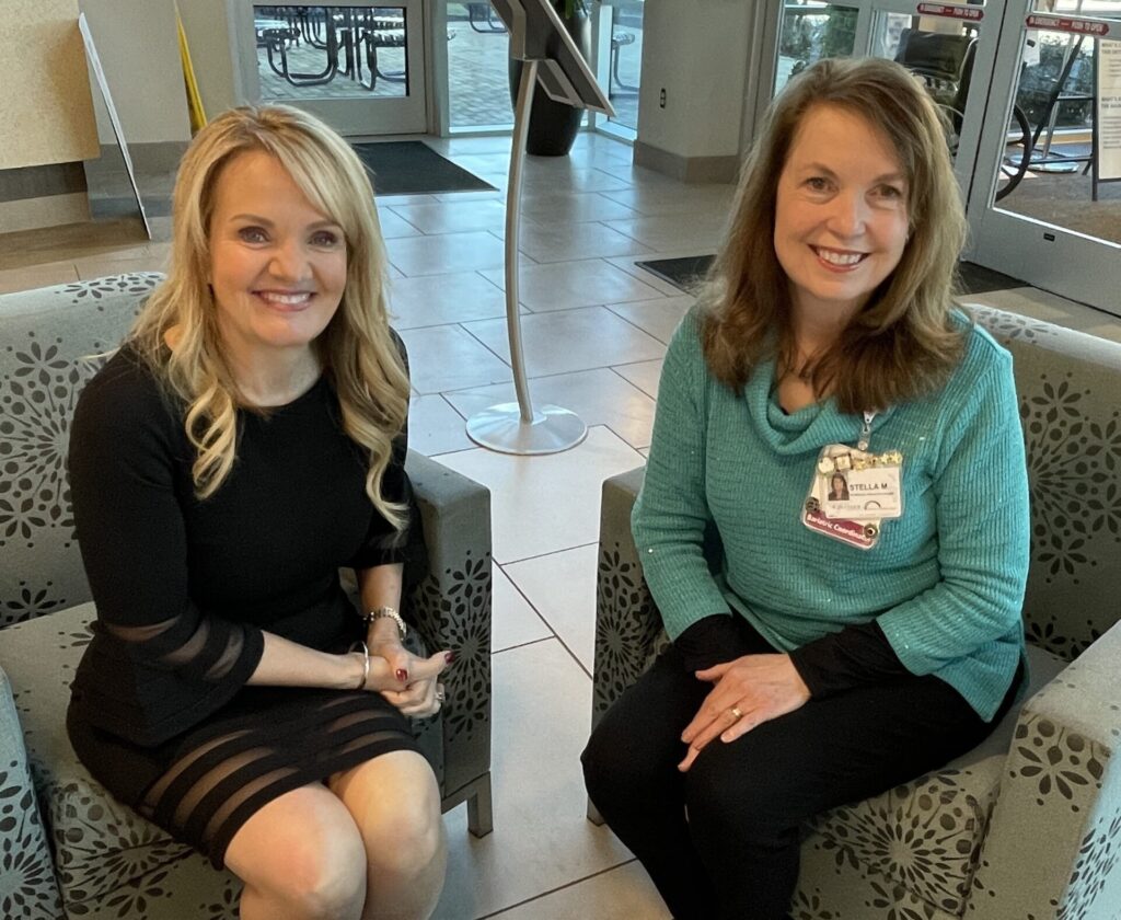 Josie Wilson wearing black dress and seated next to Parkwest bariatric coordinator Stella Mouzon, RN, who is wearing black pants and a teal sweater